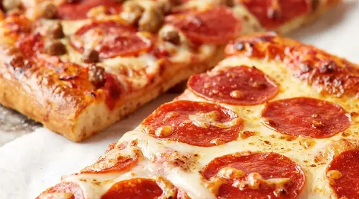 slice of pepperoni and sausage pizza